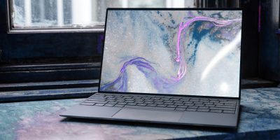 laptop on brown wooden table